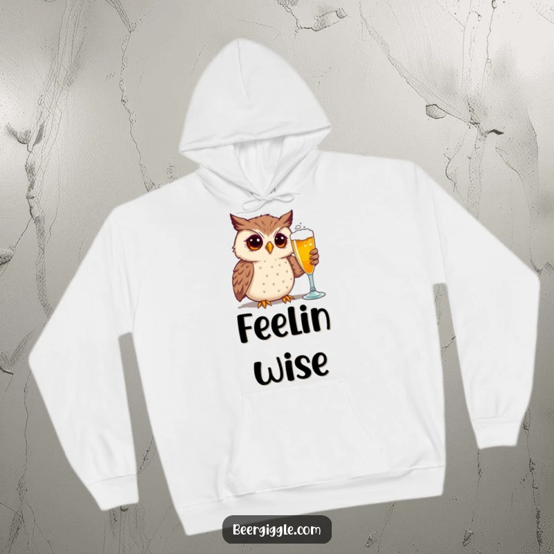 Funny hoodie showcasing a curious owl intensely admiring a beer glass, merging comfort with comic appeal.