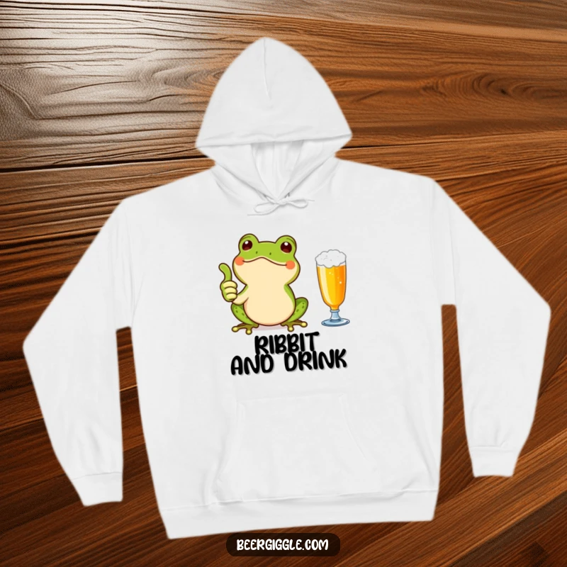 Funny Kawaii Frog Thumbs Up Hoodie: A cute frog giving a thumbs up next to a beer glass. Cozy and humorous wear for cheerful individuals.